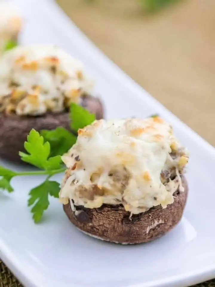 1 serving 1 lean 3 green 2.5 condiments Ingredients: 4 oz cooked chicken, cut into cubes or shredded 2 oz cheese, cheddar, reduced fat, shredded  1 1/2 cups whole white mushrooms, stems removed  1/4 tsp salt  1/8 tsp pepper  1 Tbsp low-fat cream cheese 1/4 c Cilantro  Directions: Preheat oven to 350F. Arrange mushroom caps on baking sheet. Add remaining ingredients to a food processor and pulse until well combined. Generously spoon mixture into mushroom caps. Enjoy any leftover mixture! Pop into the oven and bake between 15 to 20 minutes until the mixture is just beginning to brown on top.  Enjoy the whole pan of 'em!