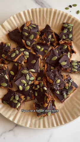 Pumpkin Spice Latte Date Bark  #sponsored  Ingredients:  ½ cup pumpkin puree  1 tsp pumpkin pie spice  1 tsp vanilla extract  ¼ cup almond butter  11-12  @Natural Delights 1/2 cup chocolate chips  ½ tbsp espresso/coffee powder  1-2 tbsp pumpkin seeds  1 tbsp crushed coffee beans  Sprinkle of flaky sea salt  Instructions:  To a skillet over medium heat, add pumpkin puree, pumpkin pie spice, and vanilla extract. Mix until well combined and most of water has cooked out of pumpkin, about 4-5 minutes.  In a small bowl, mix the pumpkin with almond butter and place in the fridge to cool. Meanwhile, place your Natural Delights Medjool dates on a sheet of parchment paper in a single layer. Cover with another sheet of parchment and use a rolling pin to flatten them into an even layer. Remove the top sheet and set aside. Spread the pumpkin mixture evenly over the flattened dates. Place it in the freezer to harden. In a small, microwave-safe bowl, melt chocolate chips, then stir in the espresso powder. Mix until well combined.  Pour the melted chocolate on top of the pumpkin and dates, and smooth into an even layer. Sprinkle with pumpkin seeds, crushed coffee beans, and flaky sea salt. Place in the refrigerator until set, at least an hour. Once firm, remove the bottom layer of parchment paper, and cut into small pieces. Enjoy! #Datebark #healthydessert #sweettreat #pumpkinspice