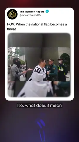You have to see this viral clip from Seoul's City Hall. A rally-goer waves the Taegeukgi during a protest against President Lee Jae-myung, only for police to demand he put it away—citing a fake 