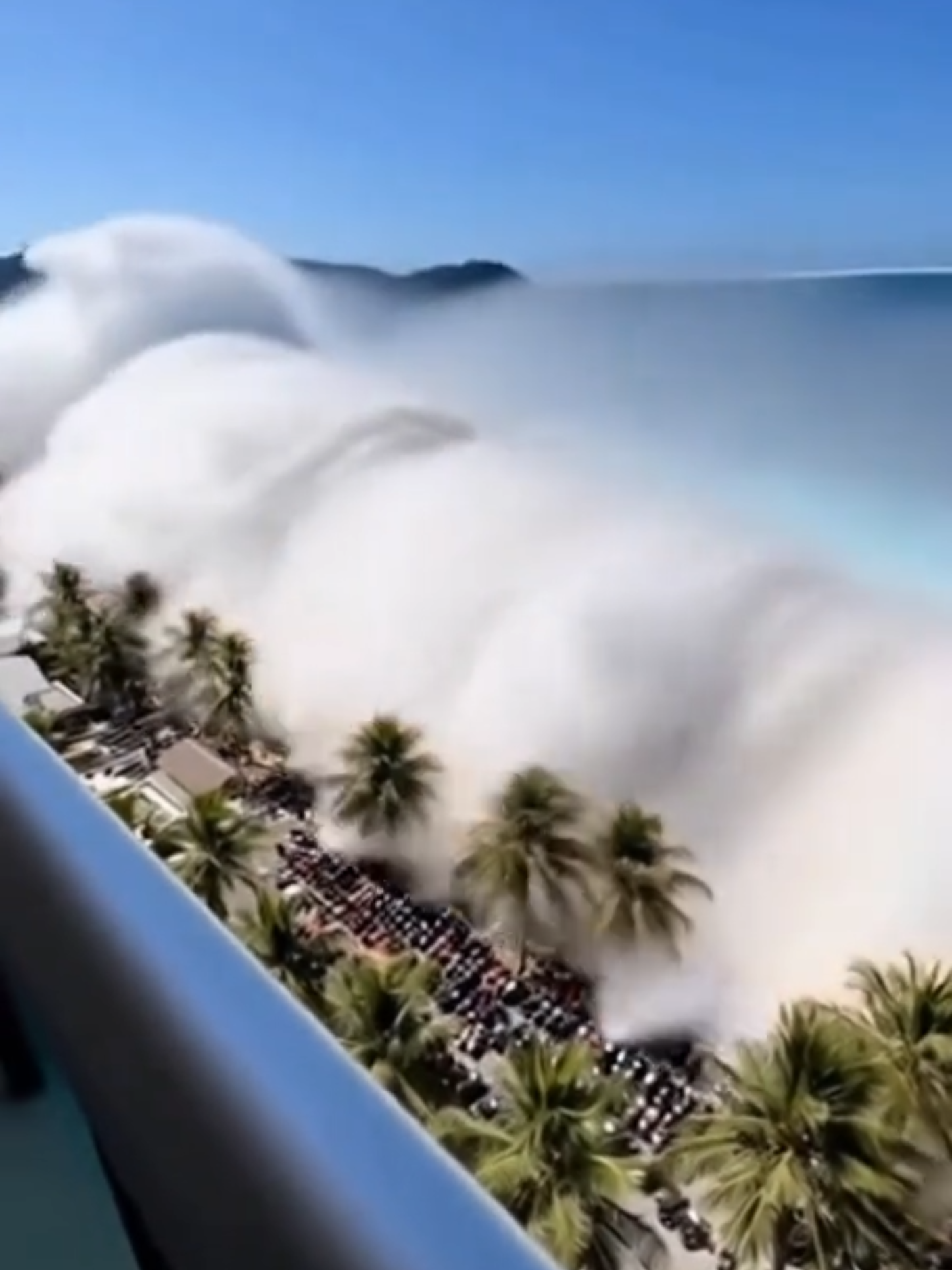 Hotel balcony view captures shocking moment tsunami wave engulfs crowded beach—real reactions, city in awe, nobody hurt : CGI, VFX 🌊🏨🌴 Visual effects simulation! Realistic POV, no one harmed, pure digital editing. Watch how the city responds as the wave hits—filmed from tourist hotel balcony. #TsunamiPOV #BeachShock #HotelView #CityReacts #ViralMoment #WaveWitness #POVShot #CGI #VFX ✨