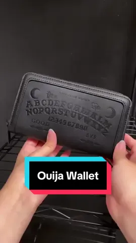 Ouija Wallet available here on TikTok shop! Get FREE shipping for a limited time only. #wallet #ouija #blackcraftcult  Faux leather zip around wallet with our Ouija design embossed on front. Gunmetal finish Blackcraft logo zipper and metal plaque. Features interior zip pocket as well as 12 credit card slots and custom interior lining. Dimensions: 8
