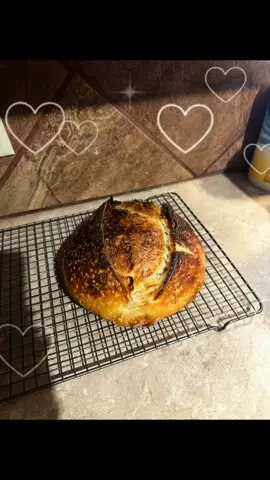 I just made a basic bish today but she was AMAZING as expected. 🍞😇 FULL RECIPE: 100-115g of bubbly starter 325g of water 500g of flour 10g salt 10g honey 1. Combine water and starter in your bowl, it will be milky and chunky (ew) 2. Add flour and mix roughly. Throw in the salt and honey and then mix more.  3. Wait 45-60 mins ⏰  4. Begin 1st set of stretch and folds. This is ONE STRETCH AND FOLD PER 1/4 TURN. So you will treat it like a square and use “4 sides” 5. Wait 30 mins ⏰  6. Another set of stretch and folds, 1/4 turns bitches! 7. Wait another 30 mins ⏰  8. Stretch and folds for the last time 9. BULK FERMENTATION (8-15hrs) until doubled in size and domed ontop. If you push gently into it you will see it bounce back and it will NOT stick to your finger 10. After BF, you will take it out and stretch GENTLY into a rectangle - use the tri-fold method and then roll it up into a boule. Put it on the paper and plop it into a bowl. 11. Put in the fridge overnight for cold proof (you can 100% skip this and bake right after BF) 12. Preheat your dutch oven in your oven at 450° 13. Bake for 25 mins 14. Lower temp to 425° and remove the lid. Bake for 25 mins again 15. Take it out and let it cool before cutting into it 🤓 What else should we make? #sourdough #baking #sourdoughbread #twilight #foryoupage 