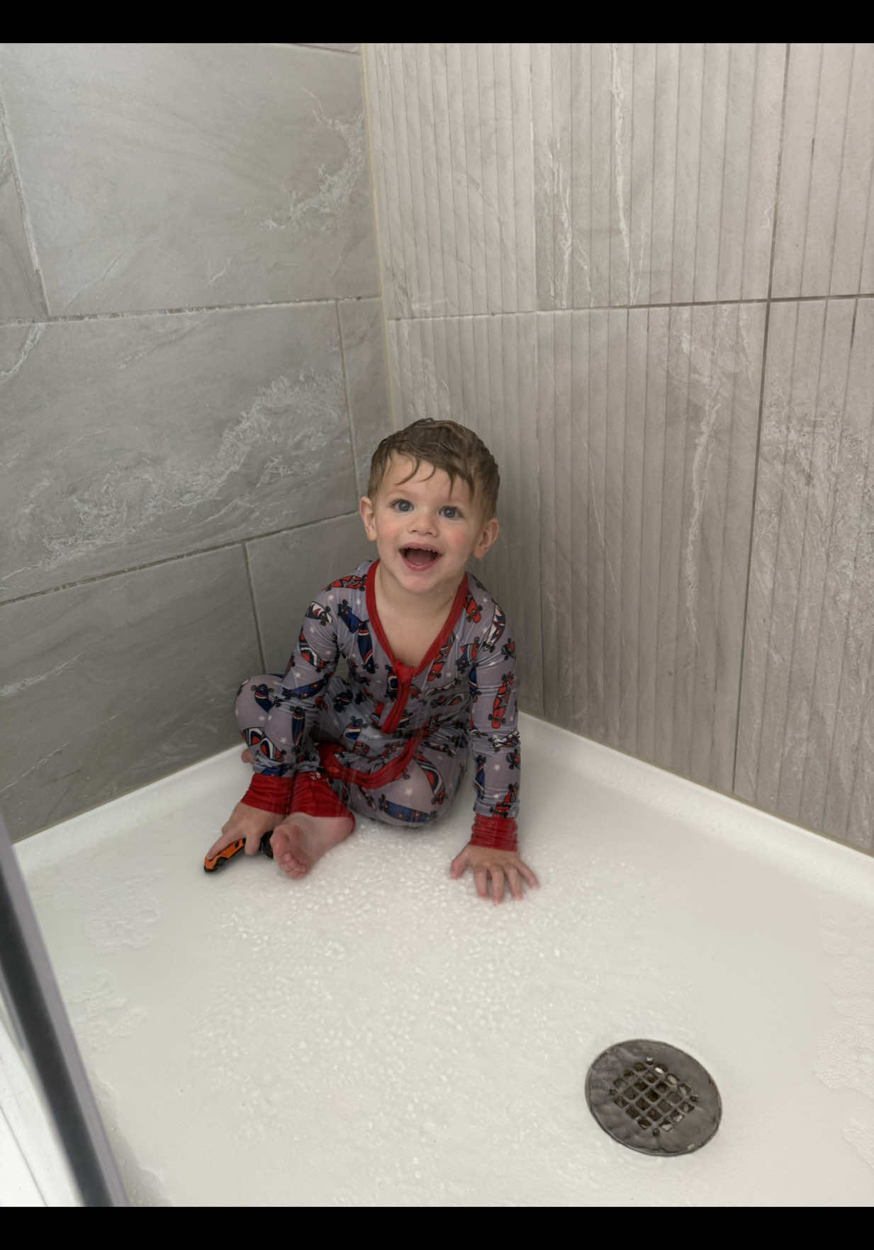 So yeah he loves showers. Even when fully clothed. Yes I was watching him, I guess I just took too long making the bed 😂😅 #toddlersoftiktok #funnytoddler #momlife 