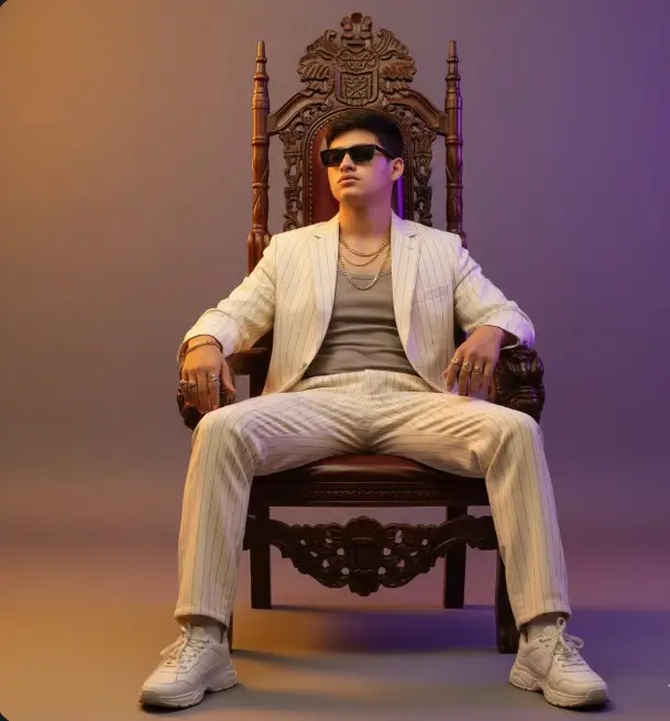 #foryoucreatersearchinsights prompt 👇  Design a cinematic fashion portrait that oozes quiet dominance and retro-luxury flair. The subject is seated regally on a baroque-style throne chair, legs wide, posture unbothered — a vision of Gen Z aristocracy. He’s styled in a soft pinstriped co-ord suit with a relaxed fit, worn over a muted tank top paired unexpectedly with chunky white sneakers that ground the look in modern streetwear. Accessories are subtle yet declarative: stacked rings, layered chains, and narrow retro sunglasses elevate the energy. Lighting is bold and theatrical — a vibrant two-tone gradient floods the backdrop and wraps around the subject: golden amber on one side, deep violet on the other. Mood: luxurious, commanding, and unapologetically elevated. #foyouofficialpage #viral_video #143 #foryourepage😍😍😍❤️❤️❤️ 