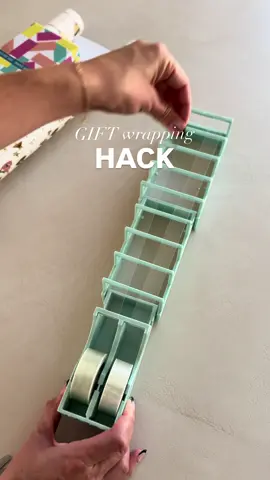 An 18-strip tape dispenser, your ultimate gift wrapping hack 🤫🎁 Comment TAPE to get a link 👌🏻 #holidays #christmas #hack #amazon #tip 