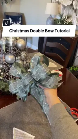 Double bow making tutorial for the holidays! This bow can be used on the top of a Christmas tree or anywhere else you may need a bow this holiday season!  Be sure to save this for later and share with someone who might need help making bows this Christmas!  #christmasbows #christmasdecorideas #bowtutorial #diychristmasdecor 