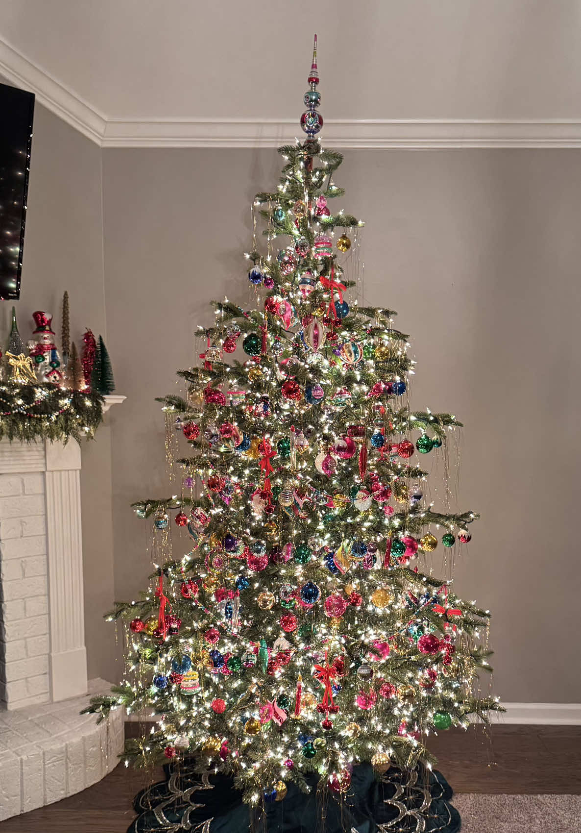 The tree and mantle of my dreams❣️These are all vintage mercury glass ornaments and garland other than the new @Christopher Radko Shiny Brite ornaments and finial I bought this year!! The bells are @Hobby Lobby (sold out online so I couldn’t link) and the candles and tinsel are @Amazon!  Shoutout to @Eva Smith for the tree recommendation🎄 Follow her for Christmas decorating tips too!  Go to the Link in my Bio for the products that are not vintage. My tree is the unlit 7.5” linked on my Amazon storefront but there is a lit version too. I linked all the Amazon products in my Amazon storefront and tree skirt is from @target linked on my @Linktree, along with mantle decor. I’ll be sharing more soon and can’t wait to share all about my tree and mantle ❤️  #christmastree #decorating #vintageornaments #finial #deckthehalls 