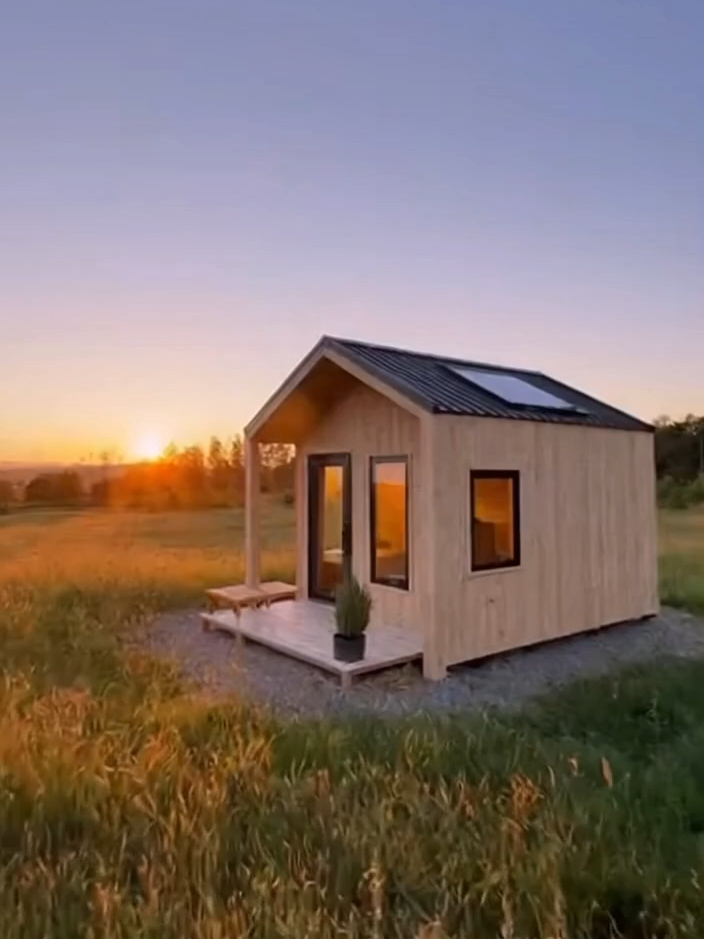 This tiny house proves you don't need a massive mortgage to live beautifully. Minimalist design and a maximum view! How much do you think this cost? 👇 #tinyhouse  #tinyhome #minimalism #offgrid #affordablereality #tinyhousetour #architecture #dreamhome