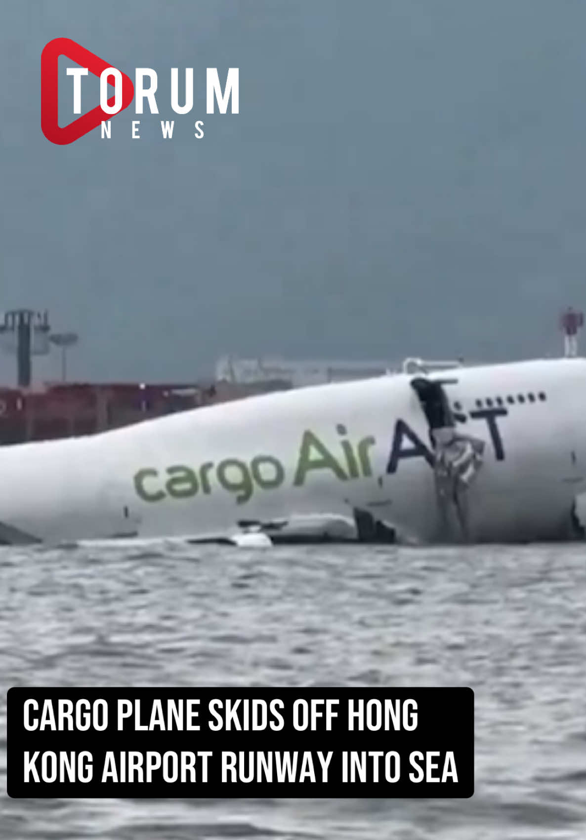 Two people have died after a Cargo Air plane skids off Hong Kong airport runway into sea. According to Fright Radar,  The Emirates flight EK9788 was arriving from Dubai at about 03:53 local time. Images from X #viral #news #hongkong #AirACTcargo747 #EmiratesSkyCargo