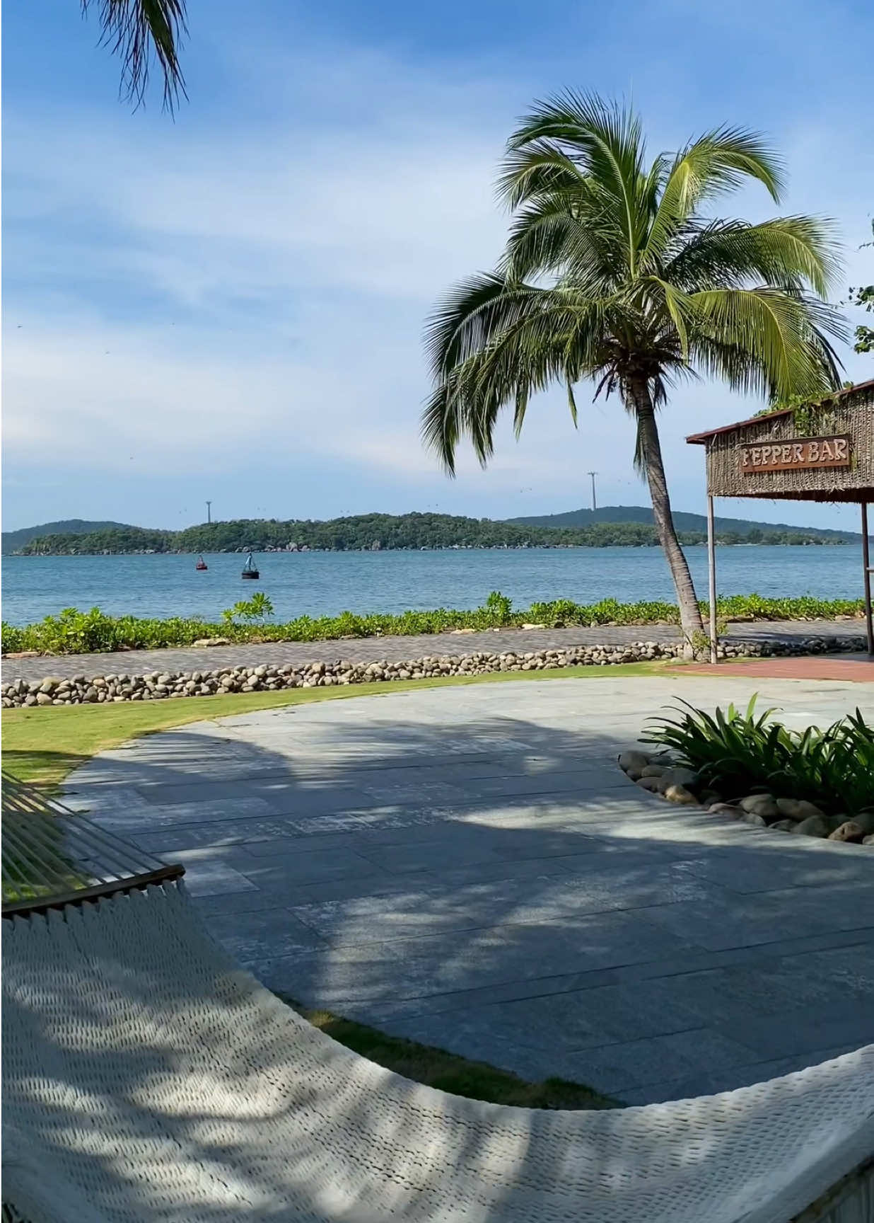Beneath the coastal sunlight and gentle hues of green, every step melts into nature — where rustling leaves and ocean waves move in perfect harmony.  Giữa ánh nắng miền biển và sắc xanh tĩnh lặng, từng bước chân như tan vào thiên nhiên — nơi tán lá và sóng biển hòa nhịp bình yên. #premiervillagephuquoc #phuquocisland #chillvibes #privatepool #resort 