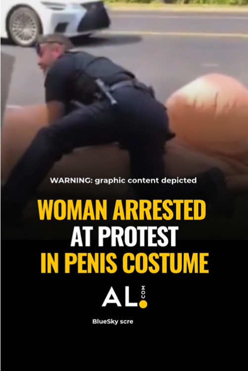 A 61-year-old woman dressed as a giant penis was handcuffed and arrested at Fairhope’s “No Kings” demonstration Saturday. While similar protests around the country were widely reported as peaceful with minimal police interaction or arrests, the Fairhope arrest has sparked outrage and ridicule. The arrest happened after officers were dispatched regarding complaints about “traffic hazards in the area.” Upon arrival, an officer observed an individual in a “phallic costume”. The officer then approached her and requested she remove her costume. Fairhope Police Lt. Shane Nolte said the woman will be charged with disorderly conduct and resisting arrest, both misdemeanors. Critics of the arrest argue whether wearing an anatomically themed costume constitutes lewd conduct or if it’s protected speech. Reporting by John Sharp #nokings #nokingsday #arrested #police #firstamendment