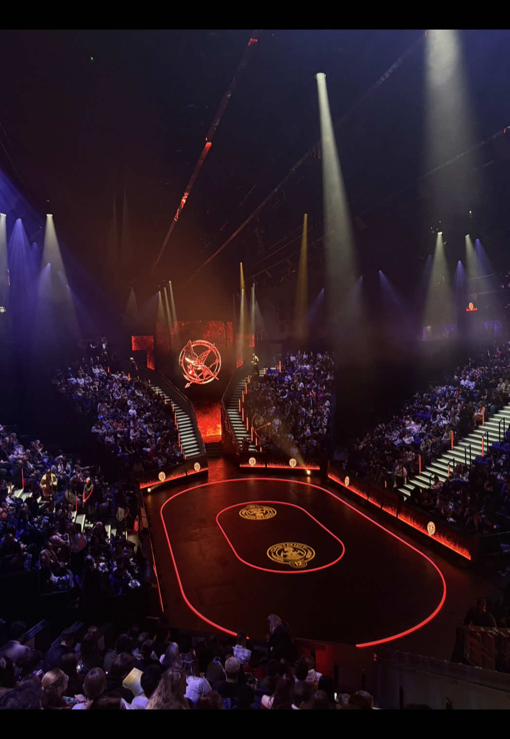 really enjoyed @The Hunger Games On Stage! with the caveat i am not a reviewer, i’m just a girl here for a good time 🥰 some faqs: - starts at 7.30pm - places to eat nearby are Hawksmoor, Dishoom, Mallow - it’s a new venue and did have a lift but i think only one so if you have accessibility requirements it’s definitely worth calling ahead to double check - my seat in this is district 2, row A, seat 102 - they checked bags but my water was allowed - i got my ticket on resale very last minute! total luck - i live nearby so can’t advise on transport but Canary Wharf station is very close plus taxis were outside - the runtime was about 2 hrs 40 but this might change - there was a 25 minute interval halfway through (right before the games start) - the games scenes are very loud so bring Loops if you need them - there are some flashing lights and effects but I can’t really advise on them so worth calling ahead - some people were dressed up but it really isn’t a requirement!  Hope you enjoy if you go!! #thehungergames #thg #thehungergamesonstage #suzannecollins #sunriseonthereaping @The Hunger Games 