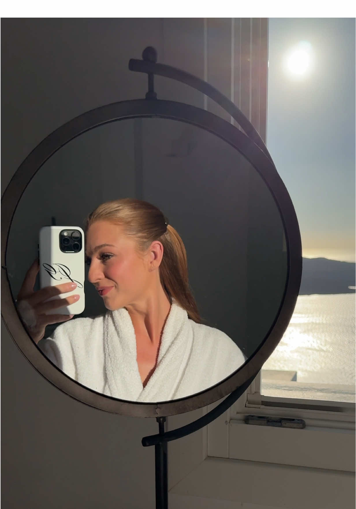 This was the most beautiful getting ready spot ever. Getting ready during a Greece sunset after spending the day relaxing & about to go eat a yummy dinner with my husband. I miss it already 💛  #greece #santorini #honeymoon #getreadywithme #makeup  @MERIT Beauty @Saie @Patrick Ta Beauty @The Dairy @Rare Beauty @Charlotte Tilbury @Kopari Beauty @ONE SIZE BEAUTY @Benefit Cosmetics @e.l.f. Cosmetics @tarte cosmetics 