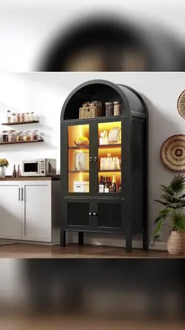 ✨ Illuminate Your Space with the DWVO 71” Tall Arched Kitchen Pantry Cabinet! ✨ Amazon must have! Transform your kitchen or dining area into a statement of modern elegance with the DWVO Arched Cabinet — where style meets smart storage. 🌟 Why You’ll Love It: 	•	Stunning Arched Design: The sleek black frame and graceful arch bring a touch of sophistication to any room, instantly elevating your décor. 	•	Built-in LED Lighting: Soft, ambient light beautifully highlights your favorite glassware, dishes, or collectibles — perfect for creating a cozy evening glow. 	•	Tempered Glass Doors: See your curated display without the dust. Durable and transparent, these glass doors add modern charm while keeping everything protected. 	•	Adjustable Shelves: Flexible storage for all your needs — from dinnerware and cookbooks to décor pieces or pantry staples. 	•	Multi-Purpose Elegance: More than a kitchen pantry — it’s a versatile showpiece for your dining room, living room, or even a stylish home office. 💡 DWVO’s 71” Arched Cabinet isn’t just furniture — it’s functional art that transforms organization into inspiration. 🖤 Bring luxury, light, and order to your home — one elegant arch at a time. #amazonmusthave #dwvoaarchedcabinet  #homedecor #pantry #giftidea Link: https://amzn.to/3IYTw4a
