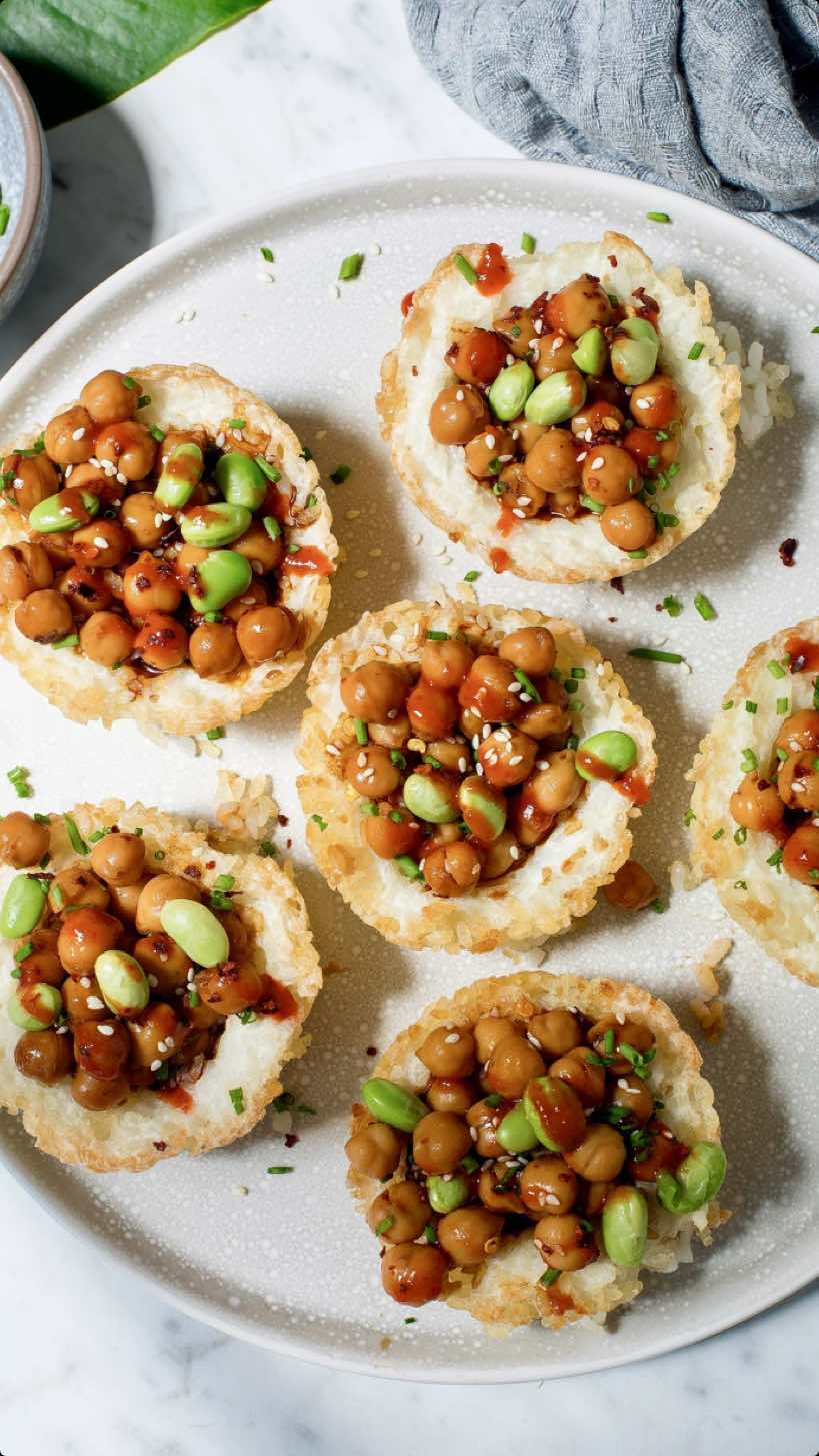 CRISPY RICE VEGGIE CUPS Got some leftover rice? Give it a delicious makeover. These cups are crunchy on the outside, soft and flavorful inside with an extra boost of plant-based protein. Perfect as a healthy snack, appetiser or light lunch idea. Recipe inspired by @seriousfoodfetish  Save the recipe below take a friend and let me know in the comments if you’re going to make it🙌 Ingredients: For the rice base: 2 cups cooked sushi rice (or jasmine rice) 1 tbsp rice vinegar 1 tsp sesame oil Pinch of salt For the filling: 1 cup cooked on canned chickpeas  1 tbsp soy sauce (or tamari for gluten-free) 1 tsp sesame oil 1 tbsp maple syrup (optional) 1 tsp rice vinegar or lime juice ½ tsp garlic powder (optional) 1 tbsp chopped green onion 1 tbsp sesame seeds To serve (optional but delicious): Sliced avocado Edamame Cucumber ribbons or grated carrot Extra sesame seeds Drizzle of sriracha  Method:  Preheat oven: to 180°C (350°F). Grease or line a muffin tray. Mix cooked rice with rice vinegar, sesame oil and salt. Spoon the rice into the muffin tray, pressing it firmly into the bottom and up the sides to form small “cups.” Bake for 10–12 minutes, until slightly golden and crisp on the edges. In a bowl, mix chickpeas with soy sauce, sesame oil, maple syrup, rice vinegar, garlic powder, green onion and sesame seeds. Spoon the filling into each rice cup. Optionally, bake for another 5 minutes to warm through. Add sliced avocado, edamame, cucumber, or drizzle with sriracha. Serve warm or at room temp. Enjoy and don’t forget to follow for more healthy recipes. #vegan #veganfood #crispyrice #rice #ricebowl #healthyfood #healthysnacks #healthybody #healthyeating #snackideas #easysnack #highprotein #highproteinmeals #vegetarianrecipes #vegetarianfood #glutenfree #viral 