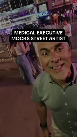 Medical Executive, David Ferrera, mocks a Nashville street artist. 