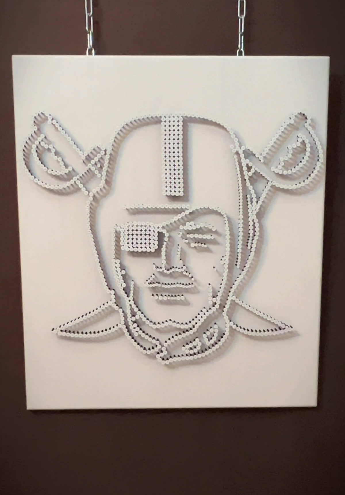 Applications open via link in bio.  Las Vegas Raiders — S-Collection White on white. Hidden black inside. Sculpted from screws — precise, silent, alive. A form that merges with the wall yet holds its own pulse — strength beneath restraint, movement beneath silence. Rivalry, power, and design — one discipline. #LasVegasRaiders #RaidersNation #NFLArt #SportsCollectors #Raiders 