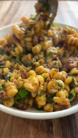 LAZY TRADER JOES EASY CHILI MAC 🔥 Welcome back to another episode of Lazy Trader Joe’s Meals from the archive. Today, we are making this simple and delicious Chili Cheese Pasta. Here’s everything you need to make it: 1 lb pasta of your choice (I am using the Organic Fusilli Corti Bucati pasta)  ¼ cup dairy-free cream cheese  2 cans of organic vegetarian chili 2 handfuls of dairy-free shredded spicy Mexican-style blend  ¼ cup of organic frozen spinach, defrosted  Green onions, for garnish (optional) Organic corn dippers, for garnish (optional)  Prepare your pasta according to package instructions. Once the pasta is cooked, drain it and add it back into the pot. On low heat, add both cans of chili and mix. Add the cream cheese and mix through until melted. Add the spicy cheese blend and mix until melted, and finally add in the spinach. Serve with either green onions, organic corn dippers, or both. Enjoy!   #vegan #traderjoes #chili #lazytraderjoesmeals 