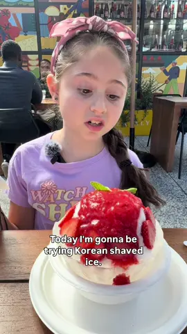 We saw this place Noon Ice bowl which is Korean shaved ice, known as bingsu. It’s a popular dessert featuring a base of shaved milk ice that has a fluffy, airy texture and melts in your mouth. It is topped with various ingredients like fruit, condensed milk, and whipped cream.  We picked out the most basic one that used the ingredients that Hannah is familiar with. She asked to leave off the whipped cream, so this was only strawberries, the strawberry puree and the shaved ice.  The fact that the milk base didn’t look like milk and was liquidy really helped. It looked like snow which was very helpful. But, the puréed strawberry caught her by surprise. It reminded her of all sorts of things and that was hard for her to challenge. Since it was a puree and not how she imagines strawberries to taste, they tasted “old” to her.  I am so proud of the fact that she tried it even though it was pretty overwhelming and had a lot going on. I was also happy to hear her say she liked the base, even thought she knew it was made of frozen milk.  I had to try it because it looked amazing to me, and it was delicious. It is super light with very mild flavor and not overly sweet. Have you tried this before?  #fyp #korean #bingsu 