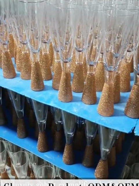 B2B Custom Glass Goblet and Glassware Manufacturer Solutions by ZGS Glass Handcrafted Luxury Goblet with Gold Dust Accent for Elegant Tableware and Tabletop Settings ZGS  Glass, a trusted glassware manufacturer, introduces its exquisite  hand-blown crystal glass goblet, designed to elevate tableware  collections worldwide. This luxury goblet combines timeless  craftsmanship with modern elegance, making it an ideal choice for both  individual use and commercial settings. As a leading glassware  manufacturer, we ensure every piece meets high standards of quality and  durability. The goblet features a delicate gold dust accent around the  handle, adding a touch of sophistication to any tabletop arrangement.  With precise dimensions—6 cm rim diameter, 4 cm base diameter, 24 cm  height—and a capacity of 240 ml, this glass goblet is both functional  and artistic. Weighing 250 g, it offers a substantial feel without  compromising on grace. Whether for fine dining or decorative purposes,  this luxury goblet exemplifies the fusion of art and utility in  tableware. Design and Craftsmanship of the Glass Goblet The  design of this glass goblet reflects ZGS Glass's commitment to  excellence as a glassware manufacturer. Each goblet is meticulously  hand-blown using premium clear crystal glass, resulting in a flawless  finish that enhances its luxury appeal. The handle is adorned with a  subtle gold dust环绕 decoration, creating a striking contrast that catches  the light beautifully. This attention to detail makes the goblet a  standout piece in any tableware collection, suitable for formal events  or everyday tabletop use. The dimensions—6 cm rim, 4 cm base, and 24 cm  height—ensure a balanced profile, while the 240 ml capacity provides  ample space for beverages. Weighing 250 g, the goblet feels substantial  yet comfortable to hold. As a glassware manufacturer, we prioritize  ergonomic design to complement modern tabletop aesthetics, making this  glass goblet a versatile addition to any dining experience. #glassware #glasswaremanufacturer #tableware #goblet