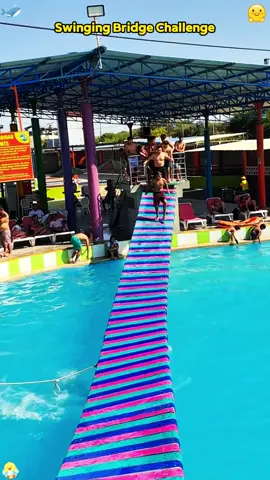 Who can pass the swing bridge challenge? Be sure to watch until the end#puenteextremo#aqualandia #viral #paseoescolar #PiscinasEnPiura