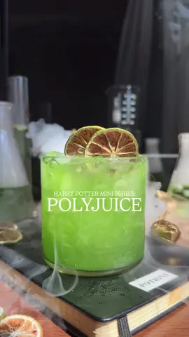 Day 3 of my Harry Potter Mini Series for Halloween! Today, we're making Polyjuice! It tastes like trouble and just might turn you into your bestie! 🪄👯‍♀️ ——— Polyjuice Potion You'll Need: 1.5 oz tequila 1 oz green apple 3/4 oz orange liqueur 1 oz fresh squeezed lime edible glitter Dried lime wheel In a shaker, combine green apple syrup, tequila, orange liqueur, lime juice, and edible glitter. Shake with ice for 8 seconds. Strain over fresh ice and garnish with dried lime wheels. ——— #harrypotter #halloween #polyjuicepotion #hogwarts 