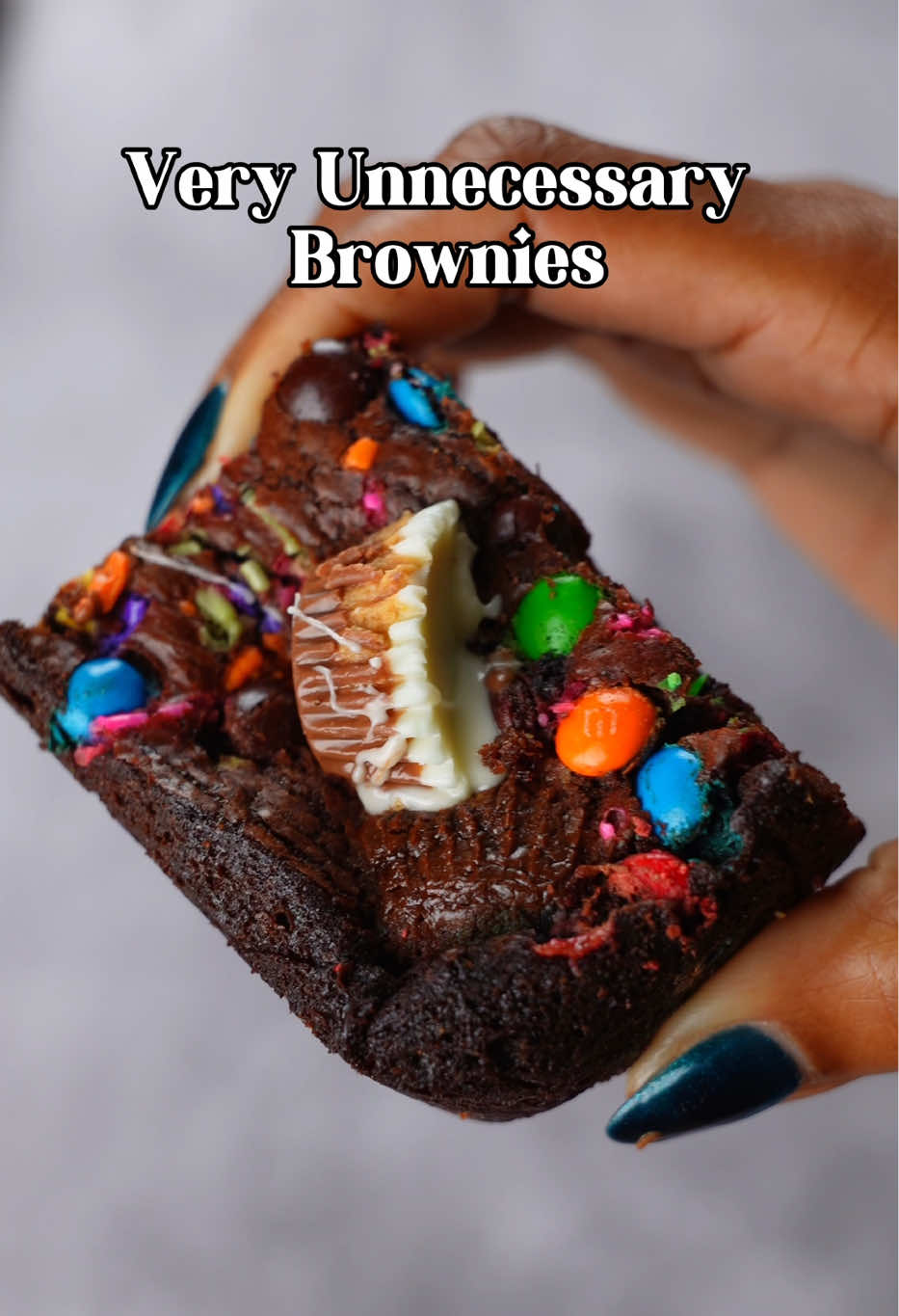 These Unnecessary Brownies are doing the absolute most — fudgy, gooey, chocolate-loaded, and baked in the @WilliamsSonoma All-Edges Pan so every bite is a corner piece 😏🍫 Browned butter, espresso, and vanilla bean paste make them rich and deep, while mini M&Ms, chocolate chips, and halved Reese’s Oreo cups take them over the edge. Literally. Because necessary? Never heard of her 💅 Unnecessary Brownies 🍫💅 (because necessary is overrated) Baked in my fave @WilliamsSonoma All-Edges Brownie Pan — every bite is a corner piece 😏 🧁 Brownie Ingredients     •    4 oz (115 g) dark chocolate, chopped     •    2 tsp (4 g) espresso powder     •    6 tbsp (30 g) Dutch-process cocoa powder, divided     •    1 ¼ cups (315 g) unsalted butter, melted or browned (optional but ✨worth it✨)     •    ¾ cup (150 g) granulated sugar     •    ½ cup (110 g) dark brown sugar     •    2 tsp vanilla bean paste     •    1 tsp kosher salt     •    3 large eggs     •    ½ cup (60 g) all-purpose flour Optional Chaos (aka mix-ins):     •    1 cup (170 g) chocolate chips     •    1 cup (160 g) mini M&Ms     •    ~12 Reese’s Oreo mini cups (cut in half) 🔥 Directions     1    Preheat oven to 350°F (177°C). Line a 9x9-inch (23x23 cm) pan with parchment paper (or use the all-edges pan 👀).     2    In a heatproof bowl, combine chopped chocolate, 2 tbsp (10 g) cocoa powder, and espresso powder.     3    Melt butter until it sizzles, then pour it over the chocolate mixture. Whisk until smooth and glossy.     4    In a mixer, beat sugars, vanilla paste, salt, and eggs on high for about 10 minutes, until thick, pale, and fluffy.     5    Add the cooled chocolate mixture — mix until smooth.     6    Sift in flour and the rest of the cocoa powder, then fold gently. Add your mix-ins (the more, the messier 💅).     7    Pour into the pan and bake 35–45 minutes, until a toothpick comes out with a few moist crumbs (not wet batter).     8    Cool, cut, and question why they’re called unnecessary when they clearly aren’t. #BrownieLoverswn#BrownieRecipeyBrownies #AllEdgesPan #WilliamsSonoma #ChocolateDessert         