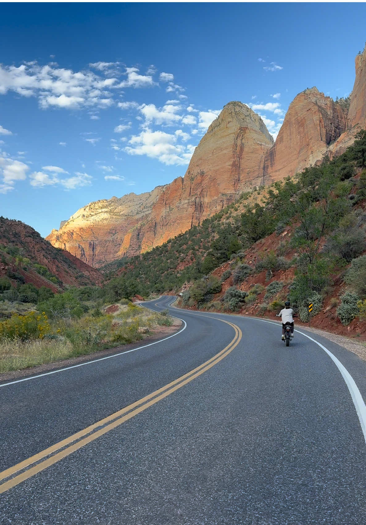 Day 2 in Zion - After hiking, we grabbed food at Oscar’s Cafe (highly recommend!)  just as it started to pour! Once the rain passed, we rented e-bikes from E-Bikes Zion and rode the Pa’rus Trail - a 3.3-mile, bike- and pet-friendly path that’s also an easy and beautiful walk if you’re on foot. We continued up to Zion Lodge, relaxed on the grass, and soaked in the views. This is a must-do while visiting Zion! #ebikes #zion #adventure #travel #nationalpark