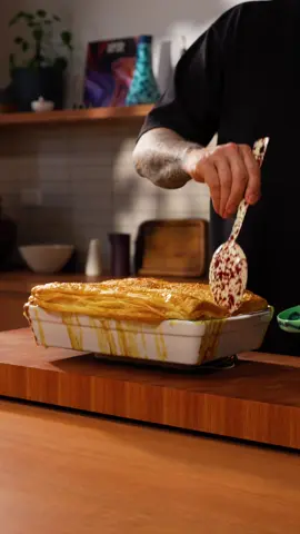 Chicken Pot Pie 🥧  Ingredients 800ml milk 500ml chicken stock 1 chicken stock cube 6 sprigs thyme 1 tsp black peppercorns 1kg chicken thighs, boneless and skinless 50ml olive oil 50g butter 2 brown onions, diced 2 carrots, diced 3 celery sticks, diced 6 cloves garlic, finely grated ½ bunch dill, chopped 3 tsp dijon mustard 100g (⅔ cup) plain flour 50g grated parmesan cheese Sea salt and black pepper, to taste 2 cups frozen peas  375g frozen puff pastry sheet, thawed 1 egg, beaten 2 tsp sesame seeds Method Step 1: Cook the chicken Combine the milk, chicken stock, stock cube, thyme, peppercorns and big pinch of salt (2g) in a large saucepan. Bring to a gentle simmer, stirring to dissolve the stock cube.  Add the chicken to the saucepan, then cover and cook on low heat for 20 mins.  Remove the chicken and strain the liquid from the saucepan into a large bowl and reserve.    When the chicken is cool enough to handle, break it up into bite size pieces.  Step 2: Cook the base Wipe out the saucepan and heat the oil and butter in it over medium heat.  Add the carrot and season with some salt. Saute for 4 minutes, until softened. Stir in the onion and cook for a further 3 minutes. Add the celery and garlic and cook for a further 3 minutes. Sprinkle over the flour and stir through the vegetables until well combined. Gradually pour in the reserved chicken liquid, stirring constantly as it comes to a simmer and thickens.  Add the chicken, parmesan, mustard and peas. Stir well to combine and season to taste. Pour mixture into a large casserole dish (3.4L /3.6qt).   Step 3: Bake and serve Preheat the oven to 180°C (356°F) Drape the pastry over the casserole dish and press in around the edges to seal.  Make a few small slits in the top for steam holes, then brush the pastry top with beaten egg. Sprinkle over sesame seeds.  Place a large tray in the bottom of the oven to catch any drips from the dish. Bake for 40-45 minutes, until the pastry is golden and puffed.  Serve warm and enjoy!  #cooking #dinner #Recipe #viral 