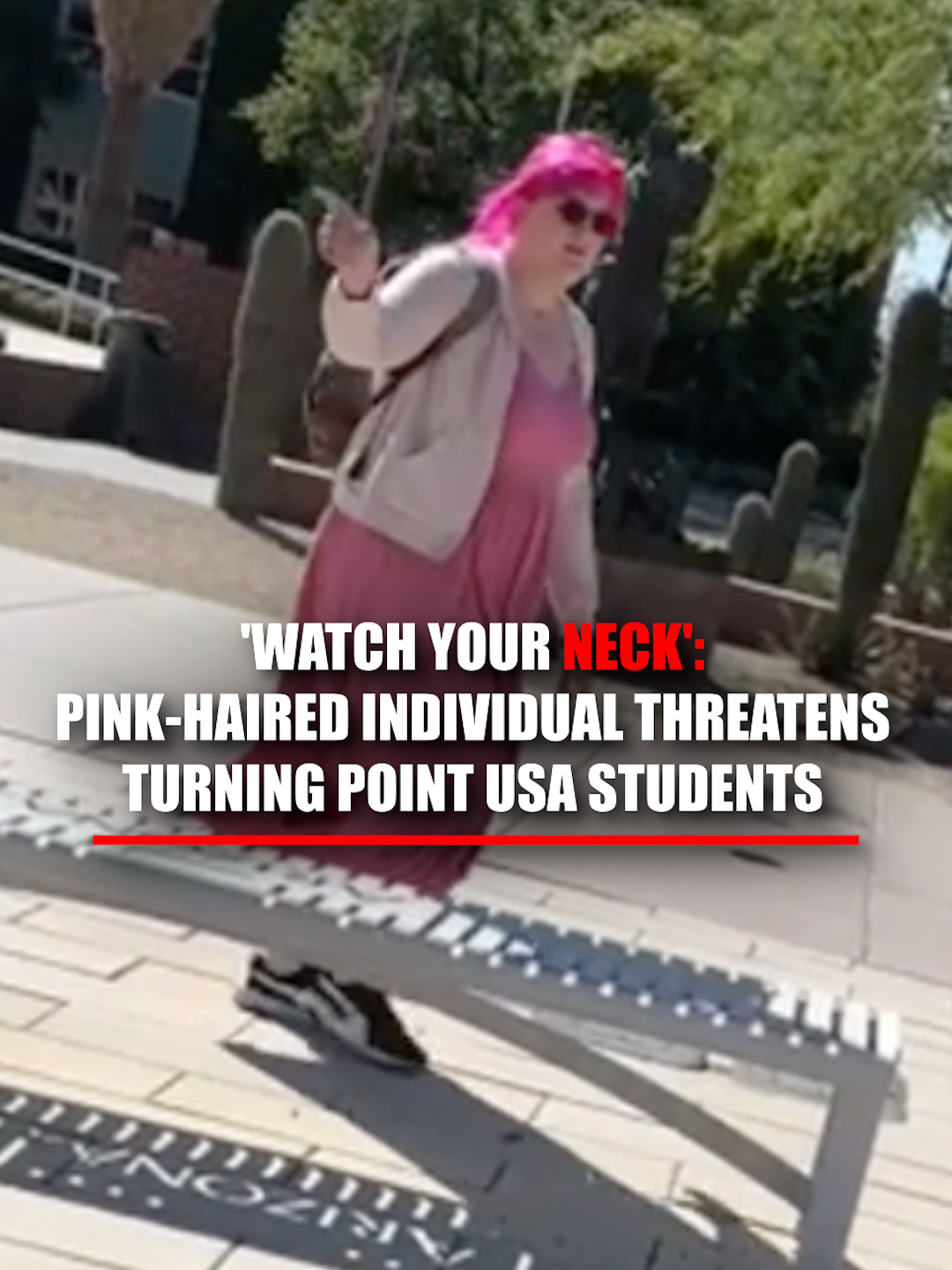 'WATCH YOUR NECK': A pink-haired individual yells, “F*** YOU NAZIS,” and warns Turning Point USA students to “watch your neck” while walking past their tent setup at the University of Arizona.