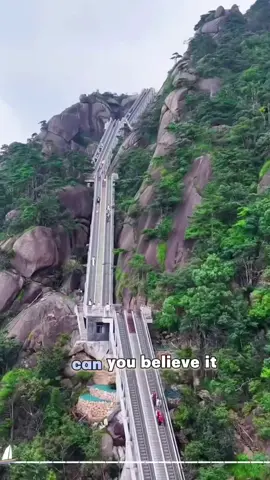 Lingshan Mountains Cloud ladder: A unique and long series of five connected escalators that ascend the mountainside, equivalent to 88 stories. It's designed to allow visitors to easily reach the summit and offers viewing platforms along the way.  #thursday #viral #fyp #kandicowboys #china 