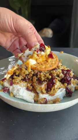 Indulge in this creamy, sweet & savory whipped goat cheese dip! Topped with a warm honey, cranberry, and walnut crunch. Add this to your must make list for the holidays! You can find the recipe below to have it saved. Enjoy! Ingredients: ¼ cup butter 2 tbsp brown sugar 2 tbsp honey 1 tsp orange zest ½ cup dried cranberries ¾ cup chopped walnuts 8 oz goat cheese 4 oz cream cheese 1 tbsp honey 2 tsp salt Orange zest to top Instructions: Place a pan over medium heat. To the pan, add butter, brown sugar, 2 tbsp honey and orange zest. Whisk together until combined, and sugar has dissolved about 2-3 mins). To the pan, add dried cranberries and walnuts and stir to combine. In a separate bowl, combine softened goat cheese, cream cheese and 1 tbsp honey and season with salt. Scoop the cheese mixture into a serving bowl and top with the walnut mixture! Serve with crackers or bread. #holidayappetizer #fallappetizers #partyfood 