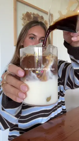 the perfect iced latte recipe below ⭐️ I’ve updated my everyday coffee recipe so of course I’m sharing it with you guys! I used to do a cold foam every morning (which is still AMAZING) but I’ve simplified it a lot so there’s barely any sugar in it. It’s so delicious so if you’re not already making your coffee at home or need a new recipe give this a try!!! 🎀 Ingredients: -LOTS of ice  -1/2-2/3 cup milk of choice (I’m a whole milk girl)  -Double shot of espresso -1-2 tsp maple syrup (add more if you want)  -pinch of salt  Instructions: - Add lots of ice to your favorite glass. Pour in milk. Pull your shot of espresso and immediately add your maple syrup and salt. Mix well then pour into your glass and enjoy!!! ✨ #icedlatte #coffeerecipe #maplesyrup #EasyRecipes #healthylifestyle 