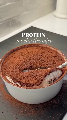 🍫Protein Mocha Tiramisu Makes 4 servings: 195 cals, 10g protein per serving This lighter tiramisu hits all the classic notes but swaps heavy cream and eggs for Greek yogurt and a touch of mascarpone. I used @Simple Mills Chocolate Brownie Sweet Thins instead of ladyfingers - they’re made with a seed and nut flour blend featuring watermelon seed flour making them a crispy crunchy snack, or a vessel to soak up the coffee really well and add an iced mocha dimension to this tiramisu. ☕️Ingredients Coffee mixture 1 cup brewed and chillled coffee (use leftover coffee if you want) 2 tbsp powdered monkfruit sweetener 2 splashes vanilla extract Greek yogurt mixture 225g (1.5 servings) 0% thick Greek yogurt 2 tbsp mascarpone cheese  1/3 cup powdered monkfruit 2-3 splashes vanilla extract 3 servings Simple Mills Chocolate Brownie Sweet Thins (1.5 servings per layer) 1 tbsp cocoa powder (for dusting) Dark chocolate for shaving (optional) 🍰Instructions 1.Mix the coffee, monkfruit, and vanilla in a shallow dish. Let it chill completely. 2.Whisk together the Greek yogurt, mascarpone, monkfruit, and vanilla until smooth. 3.Crack three eggs and separate the yolks (save them for another recipe). Whisk the whites until they  form nice peaks. 4.Gently fold the whipped whites into the yogurt mixture until fluffy. 5.Dunk 1.5 servings of Sweet Thins in the coffee for 10–15 seconds each, then layer them at the bottom  of your dish. 6.Spread half the yogurt mixture on top. 7.Repeat with the remaining Sweet Thins and coffee, then top with the rest of the yogurt mixture. 8.Dust with cocoa powder and shave dark chocolate on top. #simplemillspartner #highprotein #lowcarb #lowcarbrecipes #healthyrecipes 