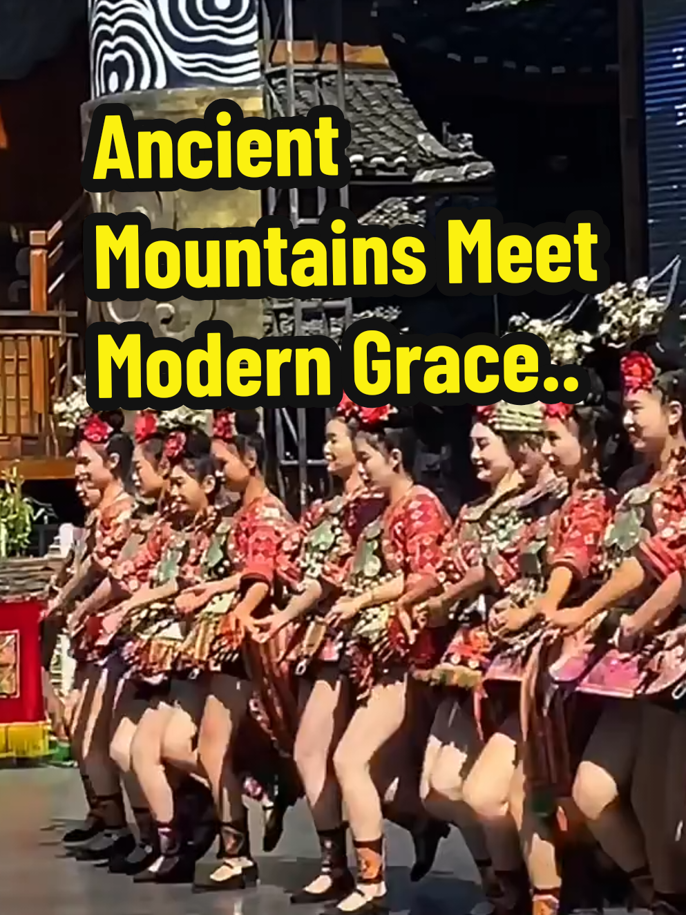 Witness the breathtaking beauty of traditional Chinese ethnic dance in full splendor! This video captures a mesmerizing performance by a group of dancers adorned in stunning, intricately embroidered costumes and dazzling silver headdresses. Set against the backdrop of ancient wooden architecture and lush green mountains, the synchronized movements and vibrant colors create a visual feast. The lead dancer, wearing an elaborate crown and flowing skirt, commands the stage with grace and power, while the ensemble moves as one, their skirts swirling like petals in the wind. A celebration of culture, heritage, and artistry that will leave you in awe! Translate - Saksikan keindahan luar biasa dari tarian tradisional etnis Tiongkok yang penuh warna! Video ini menampilkan pertunjukan memukau oleh sekelompok penari yang mengenakan kostum indah dengan bordiran rumit dan mahkota perak yang berkilauan. Dengan latar belakang arsitektur kayu kuno dan pegunungan hijau, gerakan sinkron dan warna-warna cerah menciptakan pesta visual yang menakjubkan. Penari utama, dengan mahkota megah dan rok mengembang, memimpin panggung dengan anggun dan penuh kekuatan, sementara para penari pendukung bergerak serempak, rok mereka berputar seperti kelopak bunga di angin. Sebuah perayaan budaya, warisan, dan seni yang akan membuatmu terpesona! #EthnicDance #TraditionalCulture #ChineseHeritage #CulturalPerformance #DanceOfTheMountains 