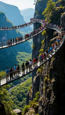 A mountaintop suspension bridge collapsed, sending people plummeting to the edge of the cliff. #viral #cliff #suspensionbridge