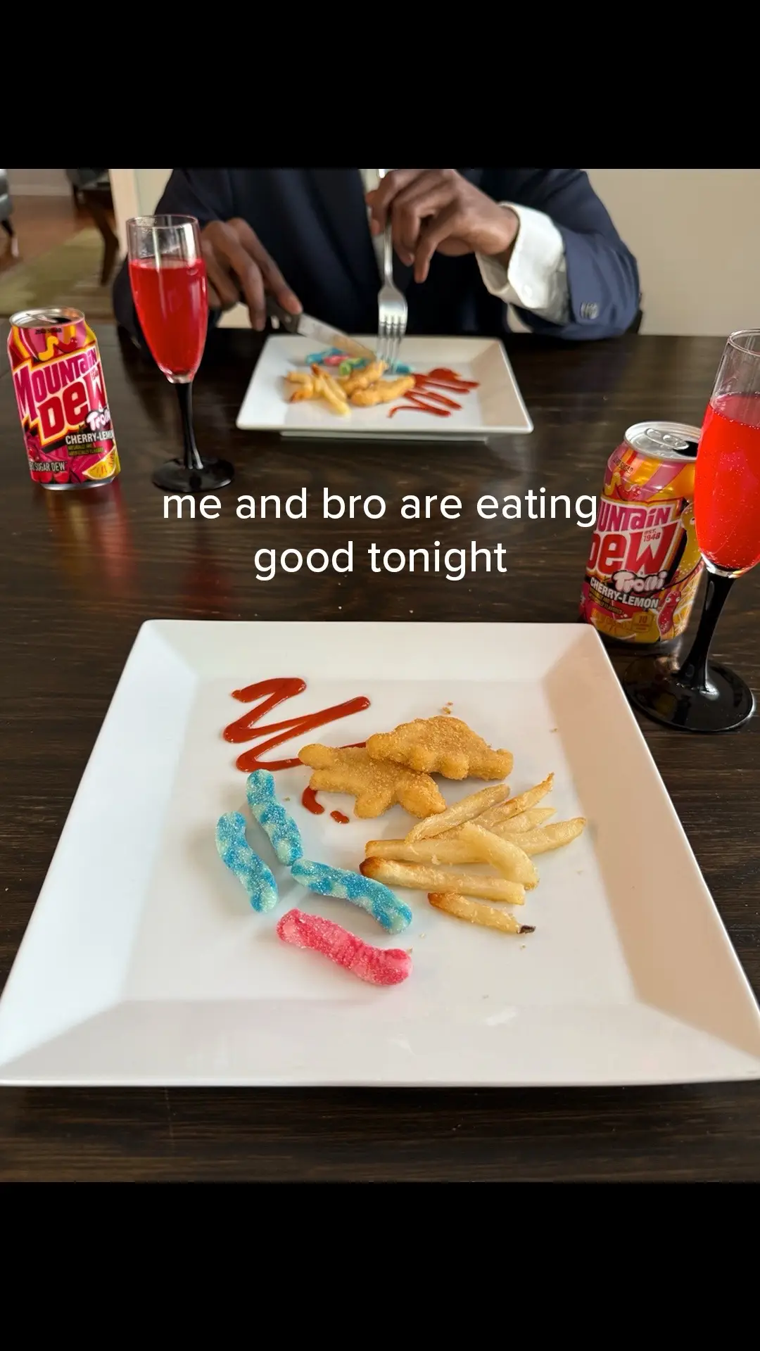 Munching on Trolli x Mountain Dew gummi worms, sipping Dew from the finest glassware…