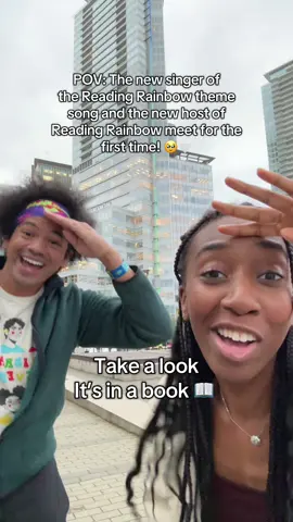 Met up with @mychal in Vancouver and figured we had to jam to the new Reading Rainbow theme song 🤎 soooo blessed to have been able to record the new theme song!! 🥹🤎 #readingrainbow @Buffalo Toronto Public Media   Video Description: Bukola and Mychal dance joyfully together in Vancouver to Bukola’s singing the Reading Rainbow revival theme song with arm waves, heart hands, and taking a look in a book!