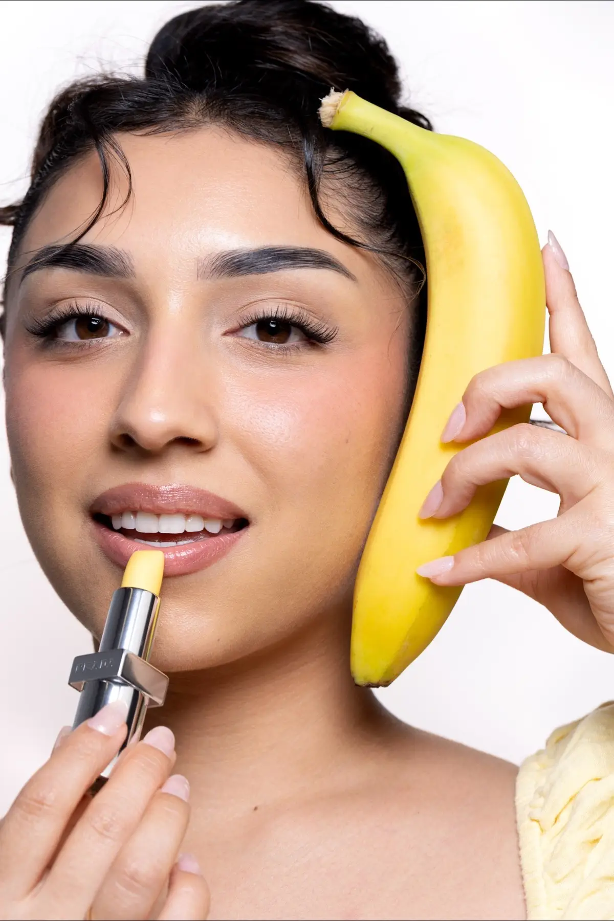 Going bananas for the @pradabeauty lip balm in Banana Yellow🍌💛 & yes, it smells like banana in a super subtle, light, elevated way✨ 📸: @Absolutelyabs !! #pradalipbalm 