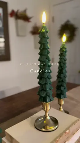 Gorgeous wax, battery-operated taper candles shaped like Christmas Trees!! You get a remote control with multiple timer functions, these always sell out super fast, so get yours before they’re gone! #christmascandles #flamelesscandle #christmasdecorations 
