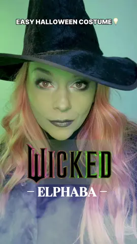 Save this for Halloween 💡 This Wicked-inspired look is easy AND a classic!  TIP for getting your green base to look its best: mix it in to your usual foundation. You’ll get a much smoother finish. 💚 I used:  @Rubies Rubies (got it at @CVS Pharmacy and also used it for my Beetlejuice look AND Stranger Things!)  @SEINT eyeshadows for contour and shimmer @wetnwildbeauty lips and gray contour  @Black Radiance Brilliant Effects eyeshadow palette (I used the neon yellow… SUCH a great, pigmented palette!)  @KISS Nails lashes  #halloweenlook #halloweencostume #halloweenmakeup #elphaba #wickedmovie 