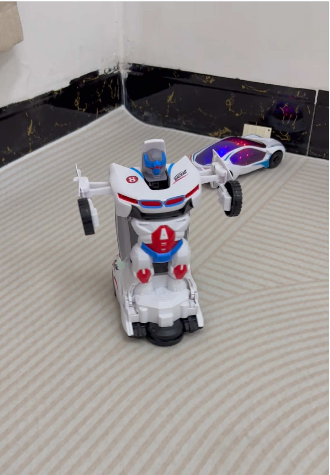 That’s so great toy gift for children! A race car transforming robot with music efforts and awareness light effects #gifts #tiktokmademebuyit #cartoy #toys #MomsofTikTok 