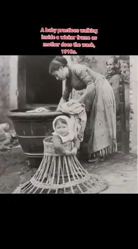 A baby practices walking inside a wicker frame as mother does the wash, 1910s. #historicalphotos #historyfacts #oldhistory #oldphotos #History 