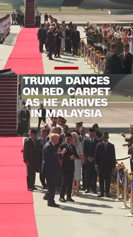 The US president was met at the airport by Malaysian officials and a crowd of onlookers waving flags and dancing ahead of a summit with leaders from the ASEAN group of nations. #CNN #News