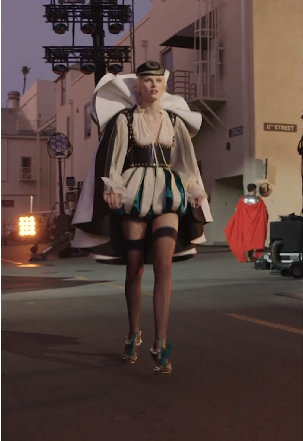 Yes, #AlexConsani just ran down the #VogueWorld: Hollywood runway in Valentino. The model closed act four of the show wearing a couture look, made up of a circle cloak with an oversize ruff collar, cream peasant blouse and bloomers. 