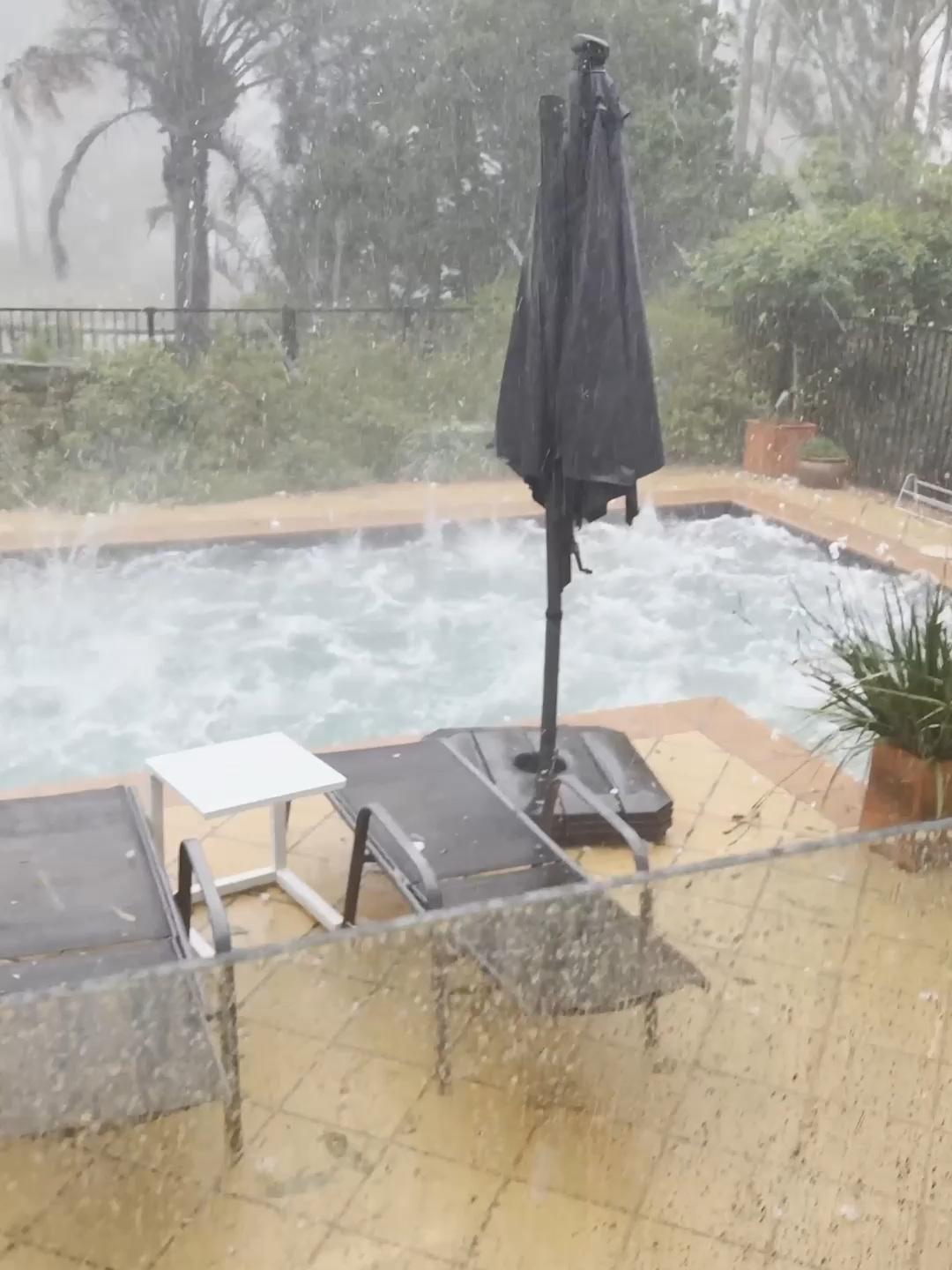 Huge hail stones churned a backyard pool and smashed car windscreens in Brisbane, Australia Sunday, as a damaging storm swept through the area.#abcnews #news #weather