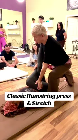 This is a classic Thai massage technique called Hamstring Press & Stretch. When you work in a clinic, the simplest methods are often the best. Do whatever helps you save energy and protect your own body. #ThaiMassage #HamstringStretch #MassageTherapy #BodyMechanics #TherapistCare  