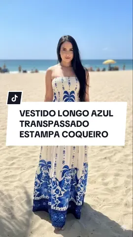 Vestido Longo Azul com Estampa de Coqueiro Tropical e Transpassado no Peito - Elegância tropical para você arrasar! Design sofisticado com fundo azul vibrante e estampas exclusivas de coqueiros e folhagens tropicais. Decote transpassado em V que valoriza o colo e alonga a silhueta com amarração lateral ajustável. Modelagem fluida em malha fria leve e respirável (92% poliéster, 8% elastano) que proporciona caimento solto e confortável. Mangas curtas delicadas com detalhes de fenda. Comprimento longo até os pés para visual elegante e fresh. Cintura marcada com elástico discreto nas costas para ajuste perfeito sem apertar. Tecido macio e anti-alérgico que não amassa fácil - perfeito para viagens! Ideal para praia, piscina, resort, festas ao ar livre, passeios em dias ensolarados ou eventos casuais. Combine com rasteiras, sandálias de salto ou tênis para looks versáteis. Fácil de lavar e secar rápido. Tamanho único ajustável (veste do 36 ao 44). O vestido perfeito para o verão! #tiktokshop #vestidolongo #tropical #modafeminina #verao  Keywords: vestido longo azul estampa tropical 2025, vestido transpassado coqueiro praia verão, vestido longo fluido malha fria respirável, comprar vestido tropical tiktokshop brasil, vestido decote v amarração lateral, vestido longo estampa havaiana elegante, vestido tropical casual resort férias, vestido azul folhagens coqueiros confortável, vestido longo verão tamanho único, vestido tropical moderno fluido leve