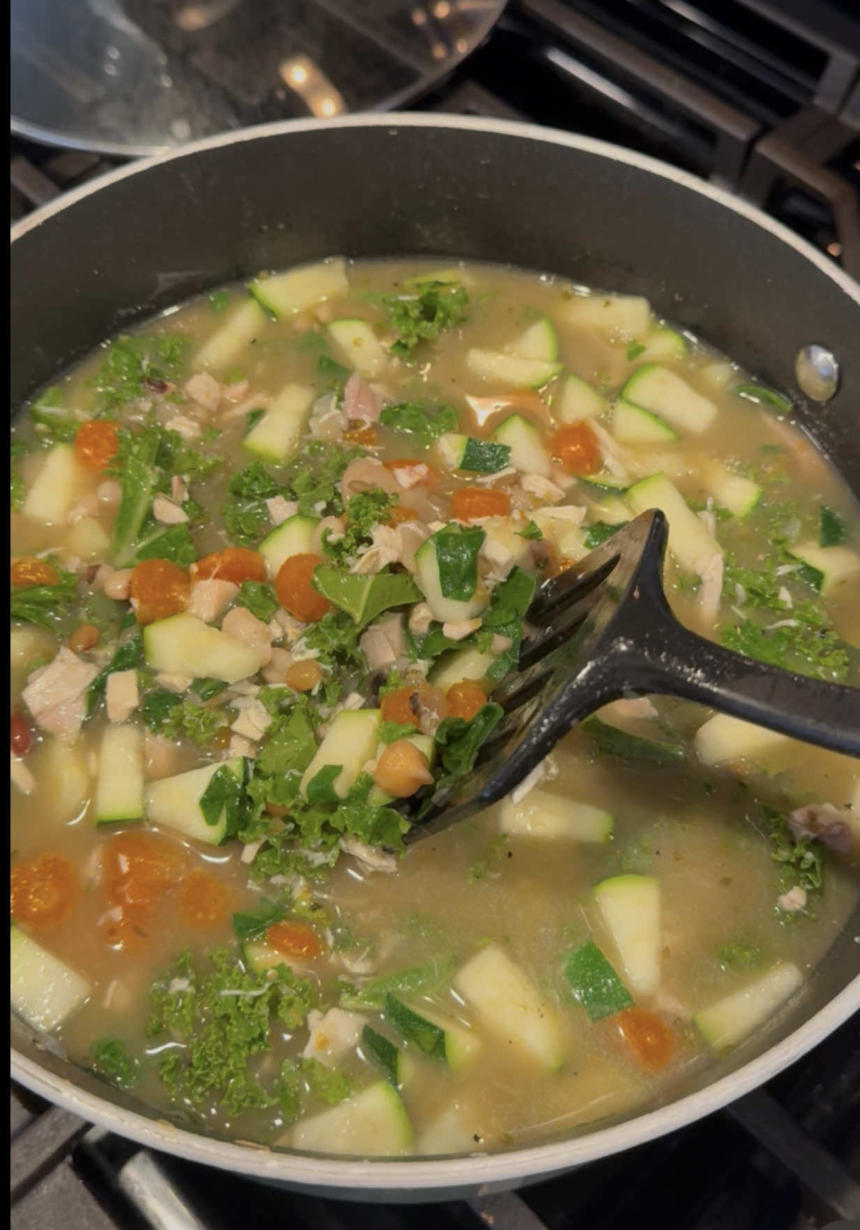 And sooooo delicious!!! Been obsessed with this lately, I’ve made it 3 weeks in a row. Be careful if you’re not used to fiber - but it’s so delicious and nutrient dense I know you’ll love it :)  Recipe: 1 small yellow onion 4 cloves minced garlic 5 carrots chopped 1.5 cup @Bob’s Red Mill 13 bean soup mix 2-3 cartons of broth (I used chicken, depends if you want more soup or chili consistency) 1 chopped zucchini  1-2 cup chopped spinach 2 large handfuls of kale Chopped up rotisserie chicken Season with salt, pepper, oregano, Italian seasoning and 1 bay leaf Directions: Sautee onion, garlic and carrots until soft Add broth and beans and seasonings Bring to simmer and cover, let cook for 60-90 mins Once cooked, add zucchini, spinach, kale and chicken for about 10-12 mins #healthyrecipes #highfiber #highproteinmeals #highproteinrecipes #weightloss