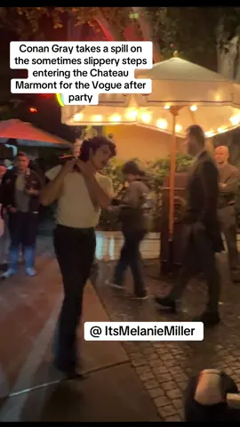 Conan Gray takes a spill on  the sometimes slippery steps  entering the Chateau  Marmont for the Vogue after  party! #conangray #fall #fail #vogueworld #hollywood